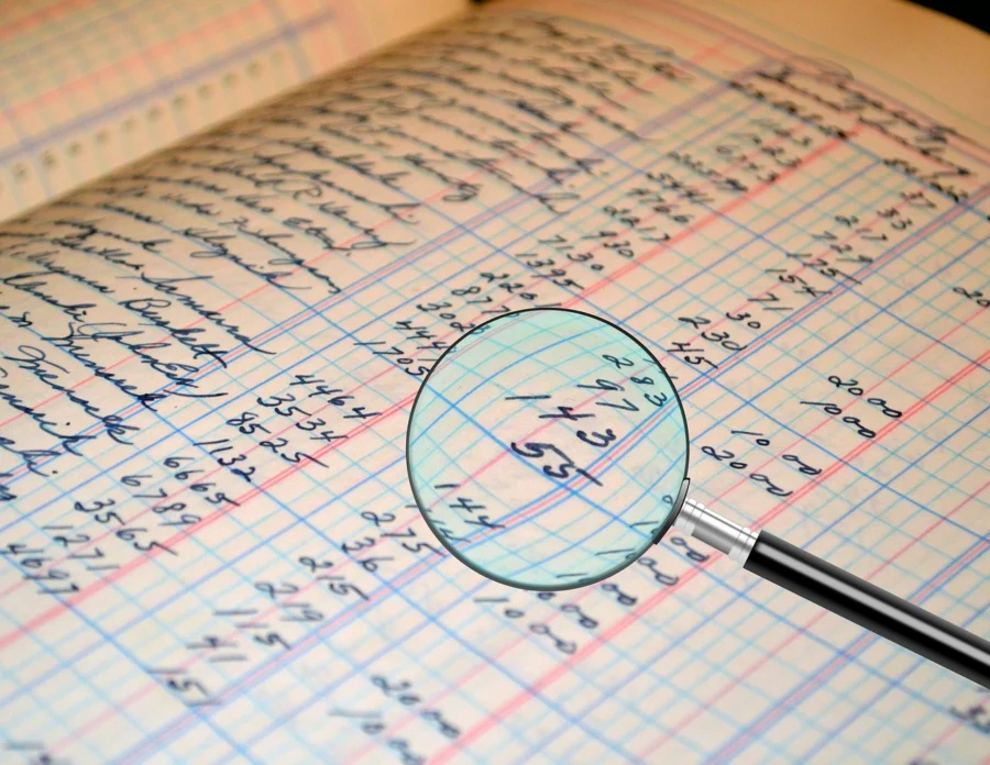 Magnifying glass over charts for risk assessment in arbitrage trading