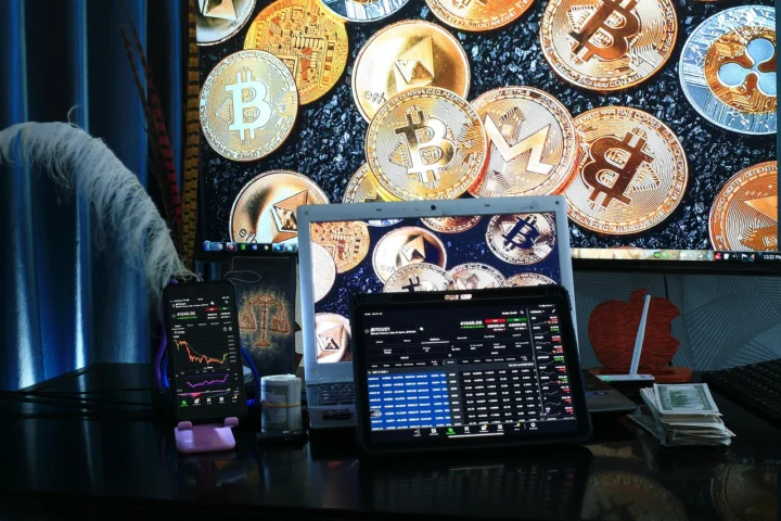 Laptop with currency exchange symbols and graphs