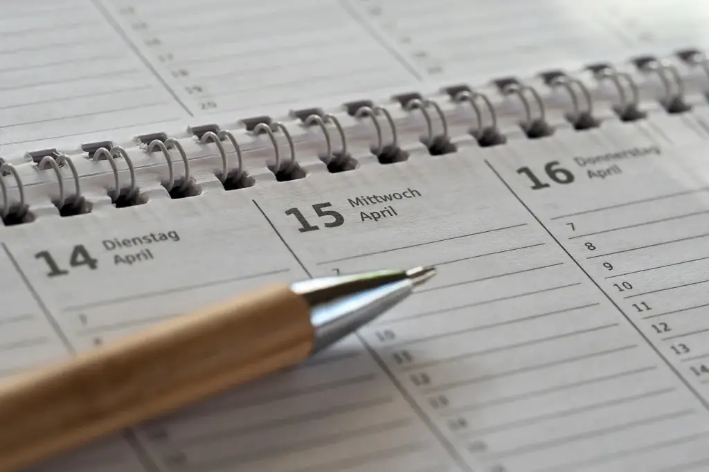 A notebook with trading notes and a calculator