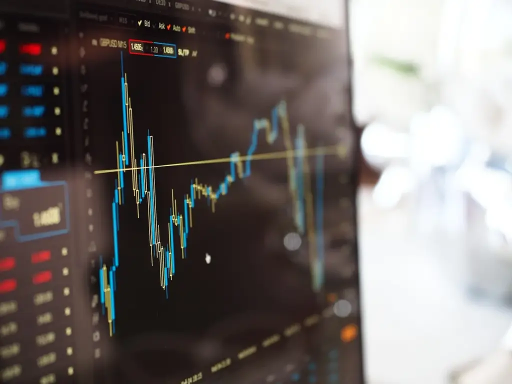 Financial data tickers on a wall showing real-time quotes